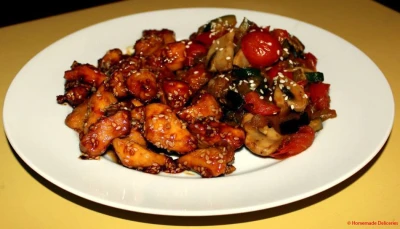 Poulet caramélisé au sésame & légumes sauce soja